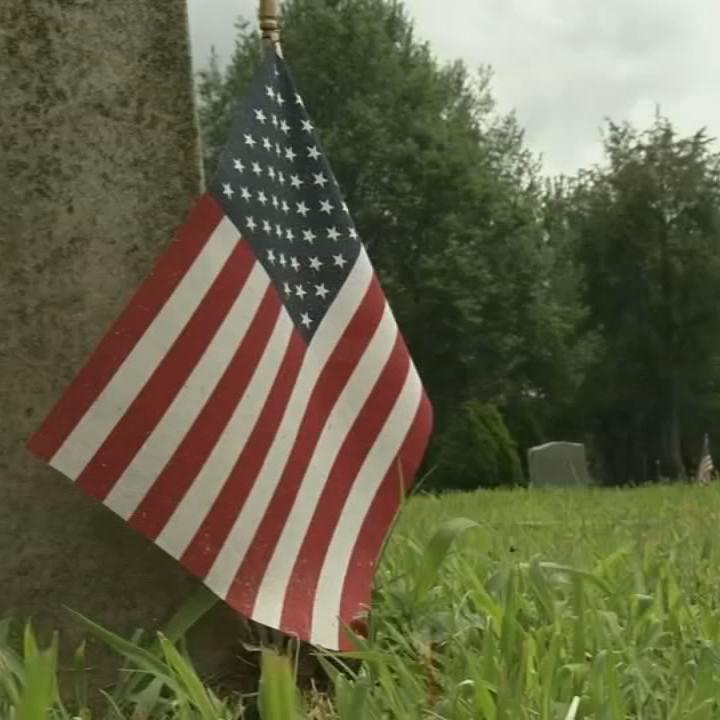 Greenwood cemetery gravestone and flag.jpg